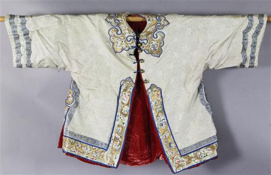 A Chinese embroidered cream silk and russet velvet robe, early 20th century, length 81cm